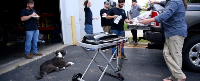 Ketch employees taking a break to cook out on the Weber Traveler grill.