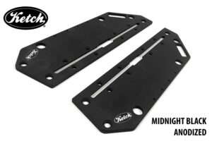 A pair of Ketch Jake plates quartering view in the Midnight Black anodized finish, ready to mount on your Hobie PA14 kayak.
