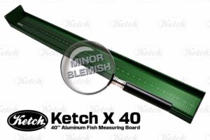 Green Ketch X 40 aluminum fish measuring board with minor cosmetic blemish highlighted by magnifying glass.