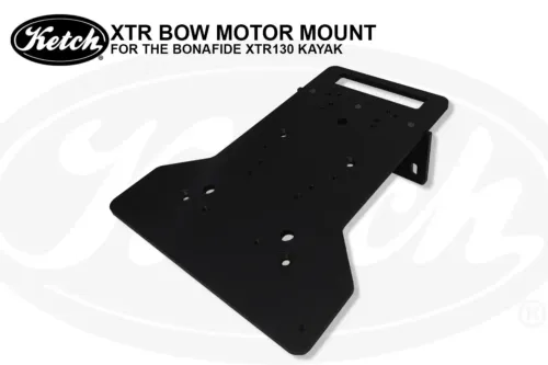 Close-up angled view of the Ketch XTR Bow Motor Mount for the Bonafide XTR130 kayak. The black anodized aluminum plate is shown with multiple pre-drilled mounting holes and a slotted cutout, highlighting its sturdy construction.