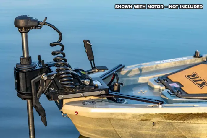 Side profile of a trolling motor installed on a Ketch bow motor mount at the front of a kayak, floating on calm water. Motor is shown for demonstration purposes only, not included.
